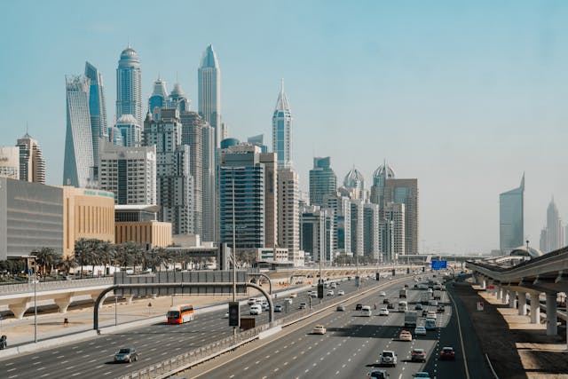 cars-on-road-near-city-buildings